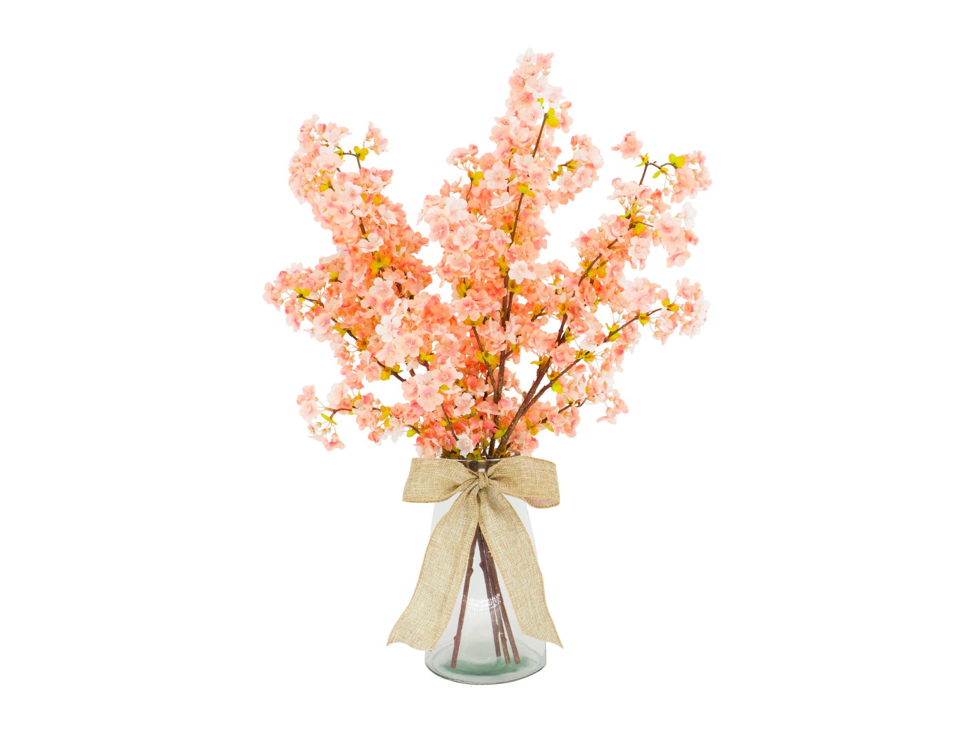 salmon colored flowers in glass vase with ribbon